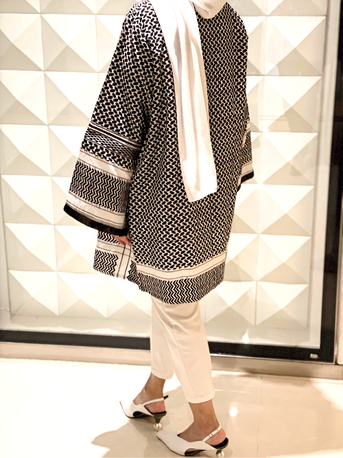 Side view of the Black & White Keffiyeh Kimono showing the draped modest silhouette and full-length cut