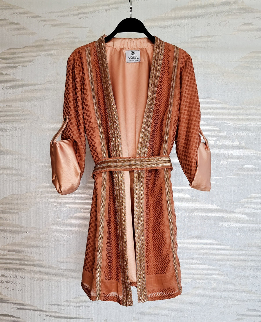 Warm Orange Keffiyeh Kimono styled with the matching belt over the satin lining