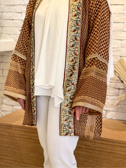 Model styling the Kayi Keffiyeh Kimono open as a modest layering piece