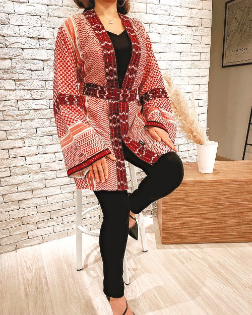 Model wearing the Red Keffiyeh Kimono over black — crimson cotton ghutrah weave, fully lined