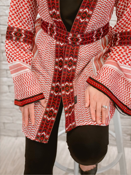 Close-up of the Red Keffiyeh Kimono showing the crimson keffiyeh weave and trim