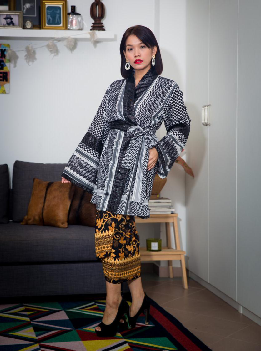 Model styling the Jet Black Keffiyeh Kimono full length over a skirt