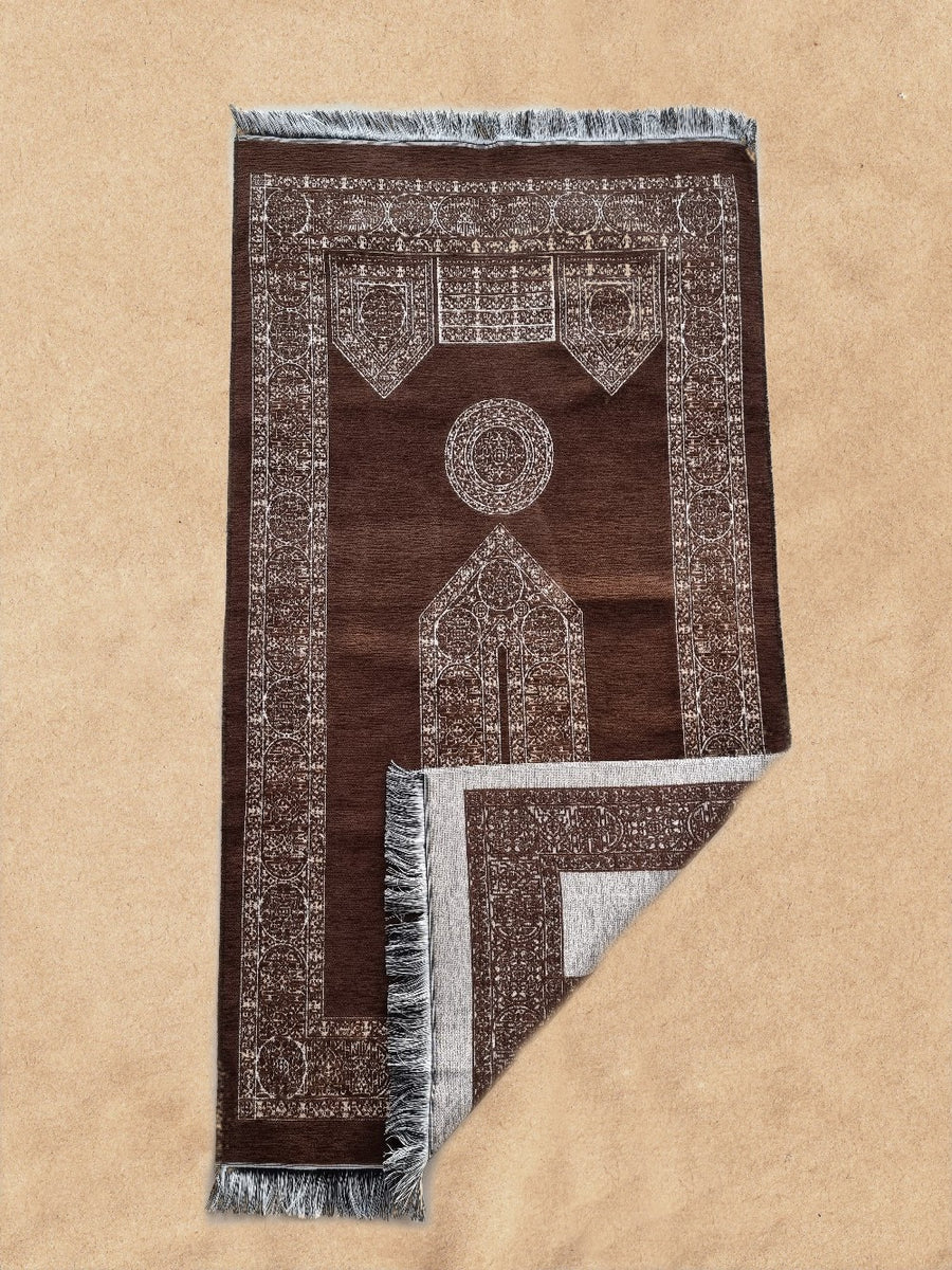 Caramel brown Mecca prayer mat with corner folded to show the underside