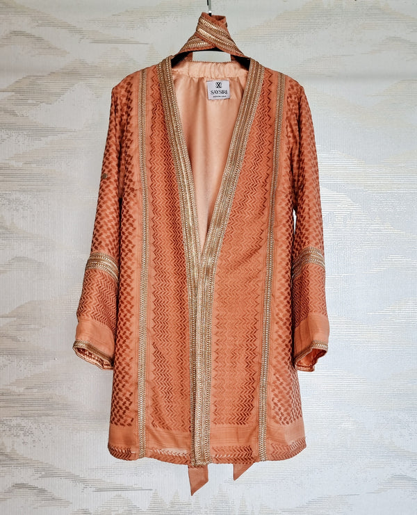 Warm Orange Keffiyeh Kimono hanging open — terracotta cotton ghutrah weave, fully lined modest outerwear