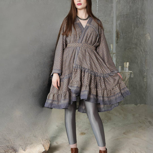 Model wearing the Keffiyeh Ruffled Midi Dress — genuine keffiyeh fabric with tiered ruffles