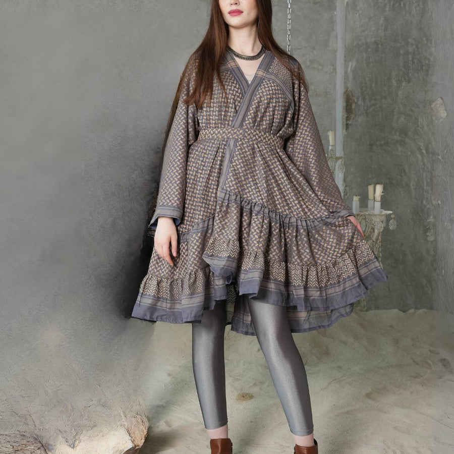 Model wearing the Keffiyeh Ruffled Midi Dress — genuine keffiyeh fabric with tiered ruffles