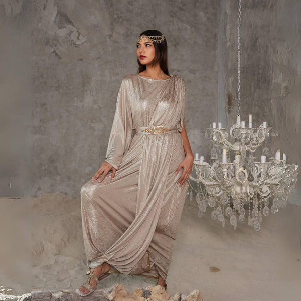 Model wearing the Athena Gold Crepe Maxi Dress full length — molten gold silky crepe with beaded belt