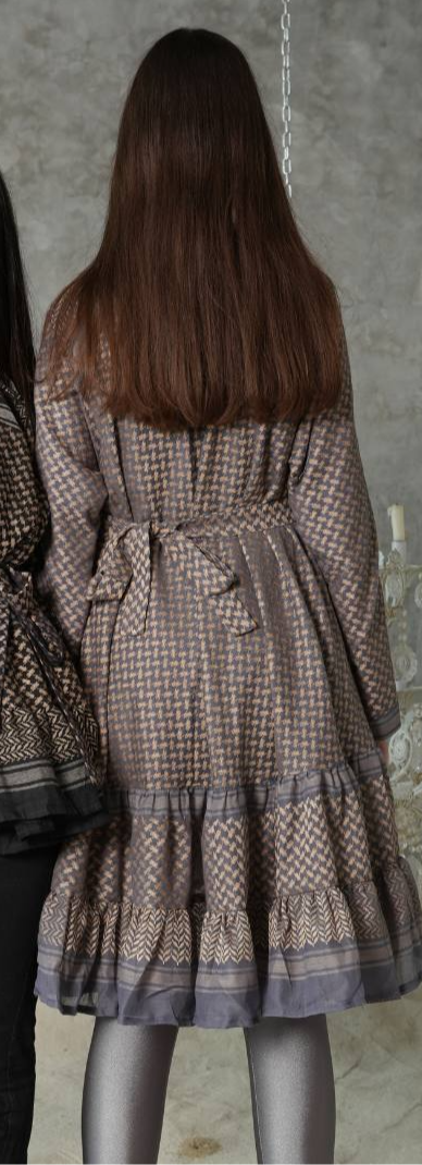 Back view of the Keffiyeh Ruffled Midi Dress showing the tie detail and tiered hem
