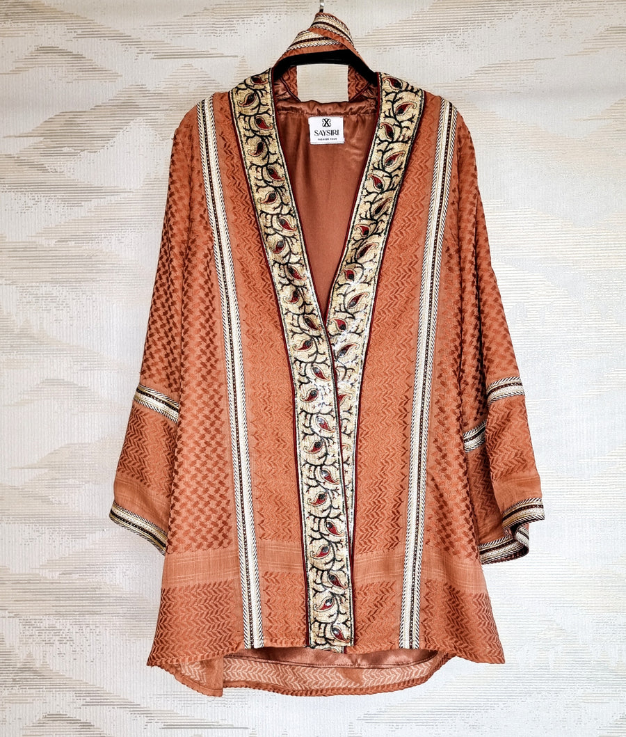 Kayi Keffiyeh Kimono hanging open, showing the olive-trimmed keffiyeh weave