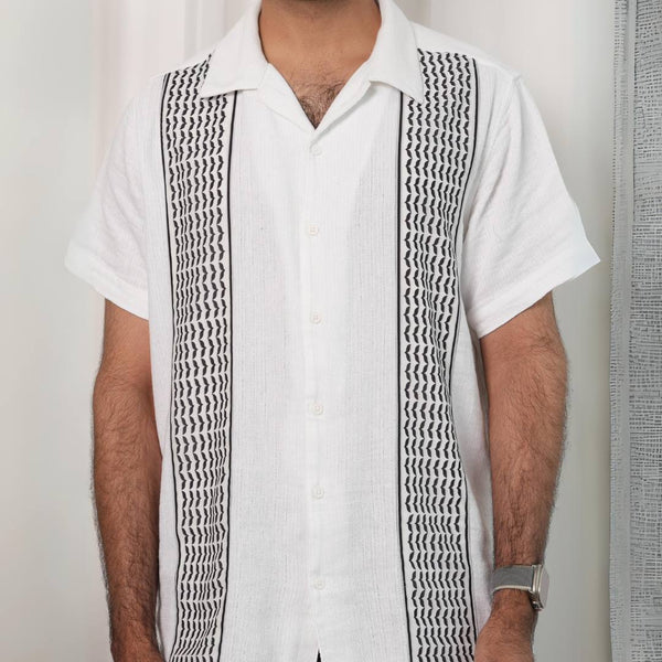 Men's Keffiyeh Camp Collar Shirt front — white cotton with woven keffiyeh panel detail