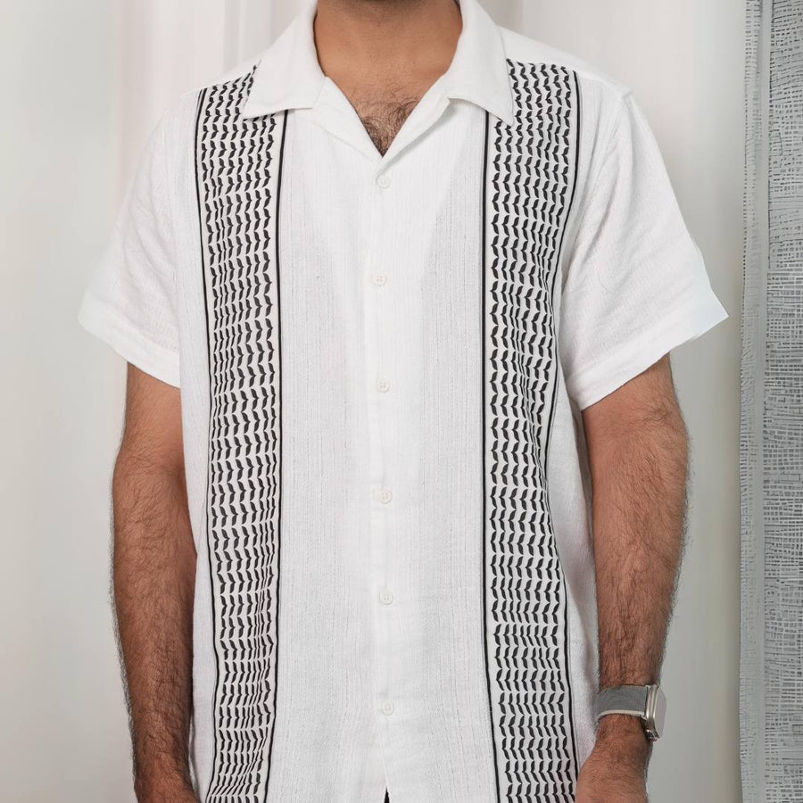 Men's Keffiyeh Camp Collar Shirt front — white cotton with woven keffiyeh panel detail