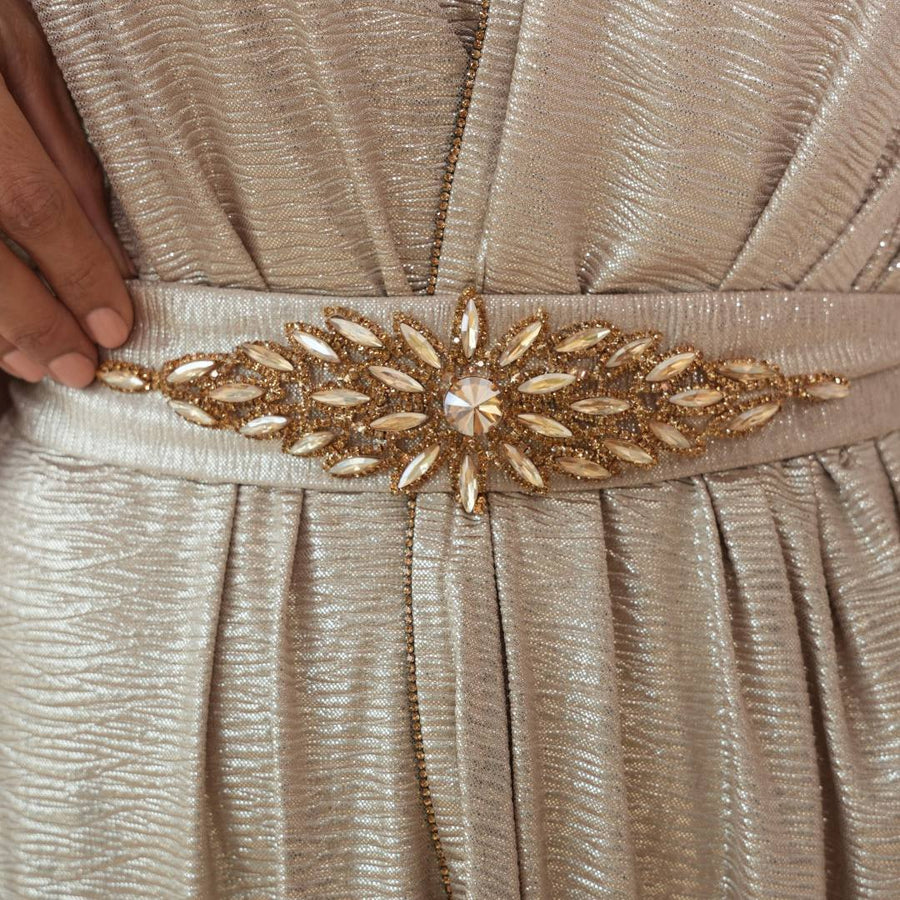 Close-up of the Athena dress gold beaded belt and crinkled crepe texture