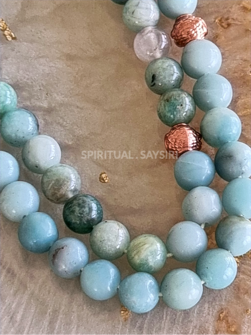 Close-up of natural amazonite gemstone beads in mixed green tones