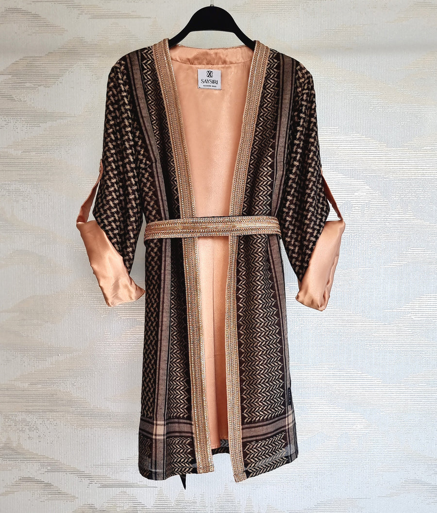 Black Gold Keffiyeh Kimono styled with the matching belt, showing the satin lining