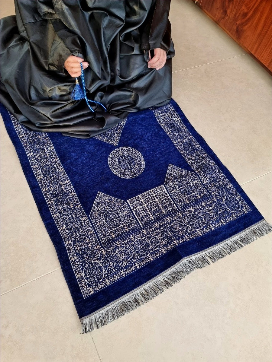 Royal Blue Mecca Collection prayer mat held up — drape and weave detail