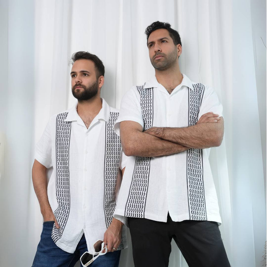 Two models wearing the Men's Keffiyeh Camp Collar Shirt, front and side views