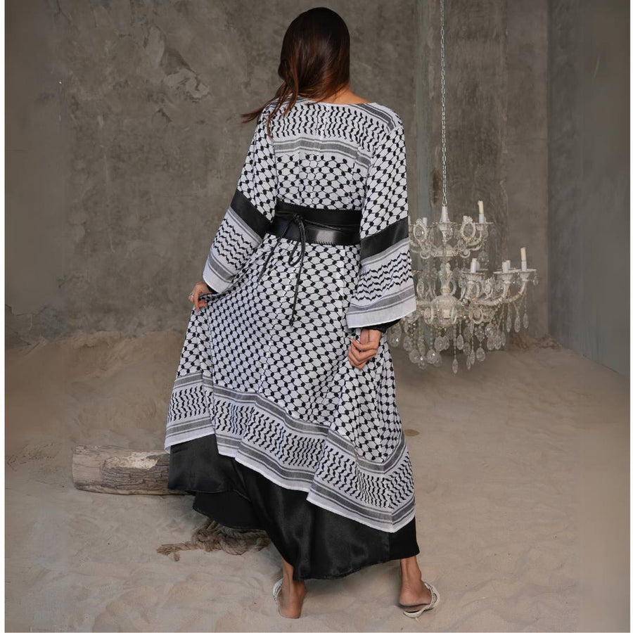 Full-length view of the Black & White Keffiyeh Kaftan with belt over black