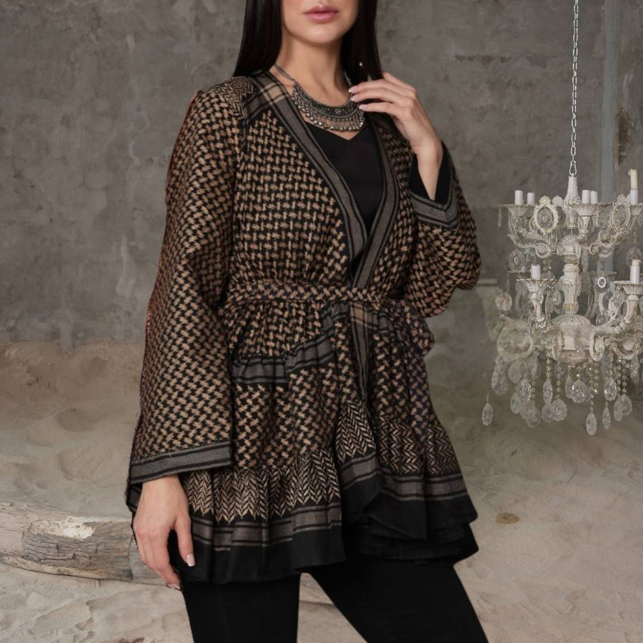 Model wearing the Keffiyeh Ruffled Babydoll Dress belted — genuine keffiyeh fabric with volume