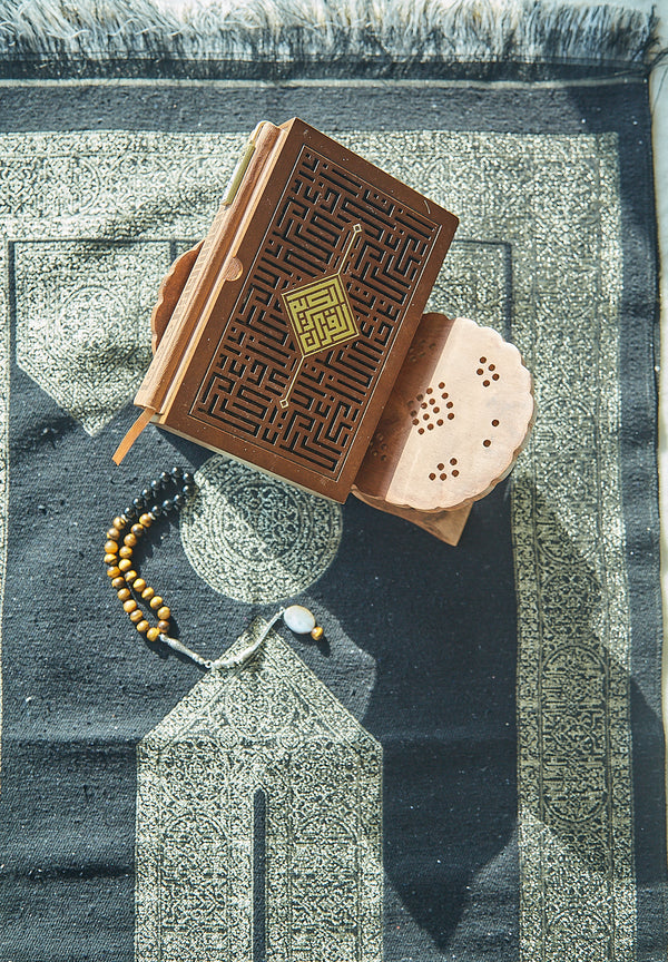 Mecca Collection sajadah prayer mat in green styled with wooden Quran stand and tasbih