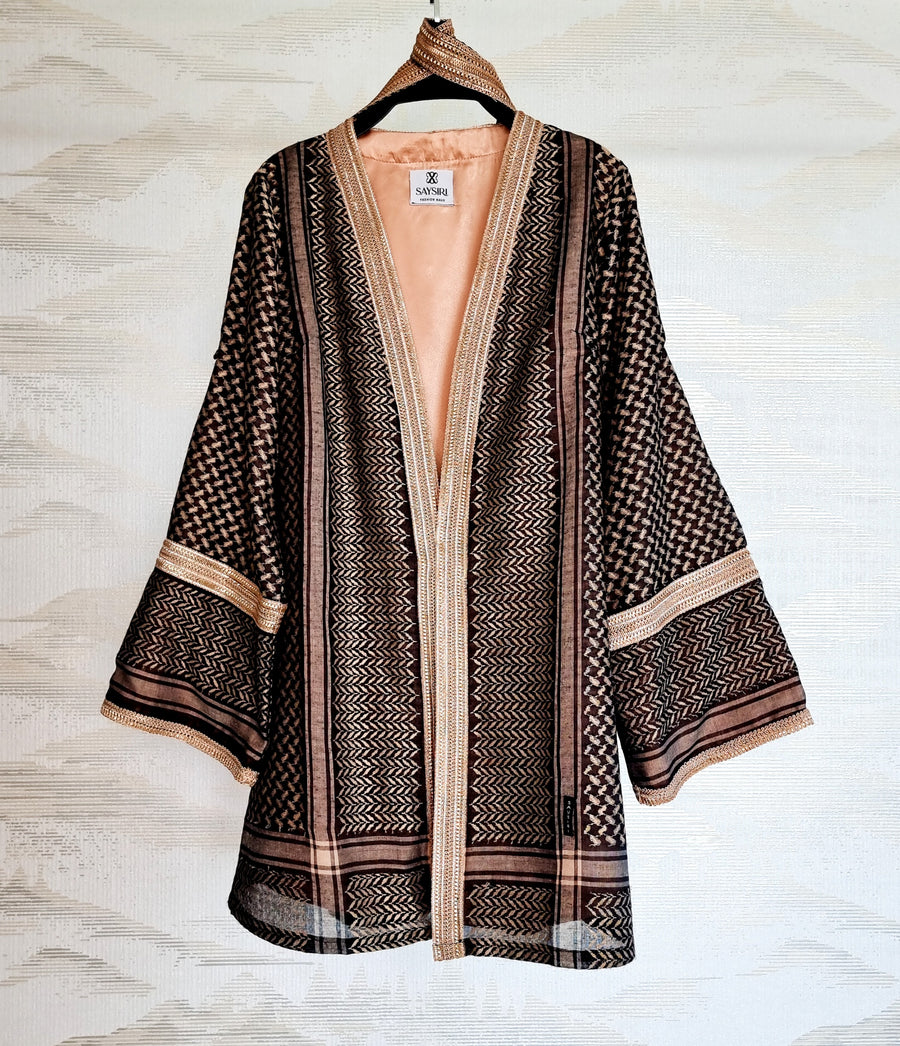 Black Gold Keffiyeh Kimono hanging open — jet black cotton ghutrah with woven gold threading, fully lined