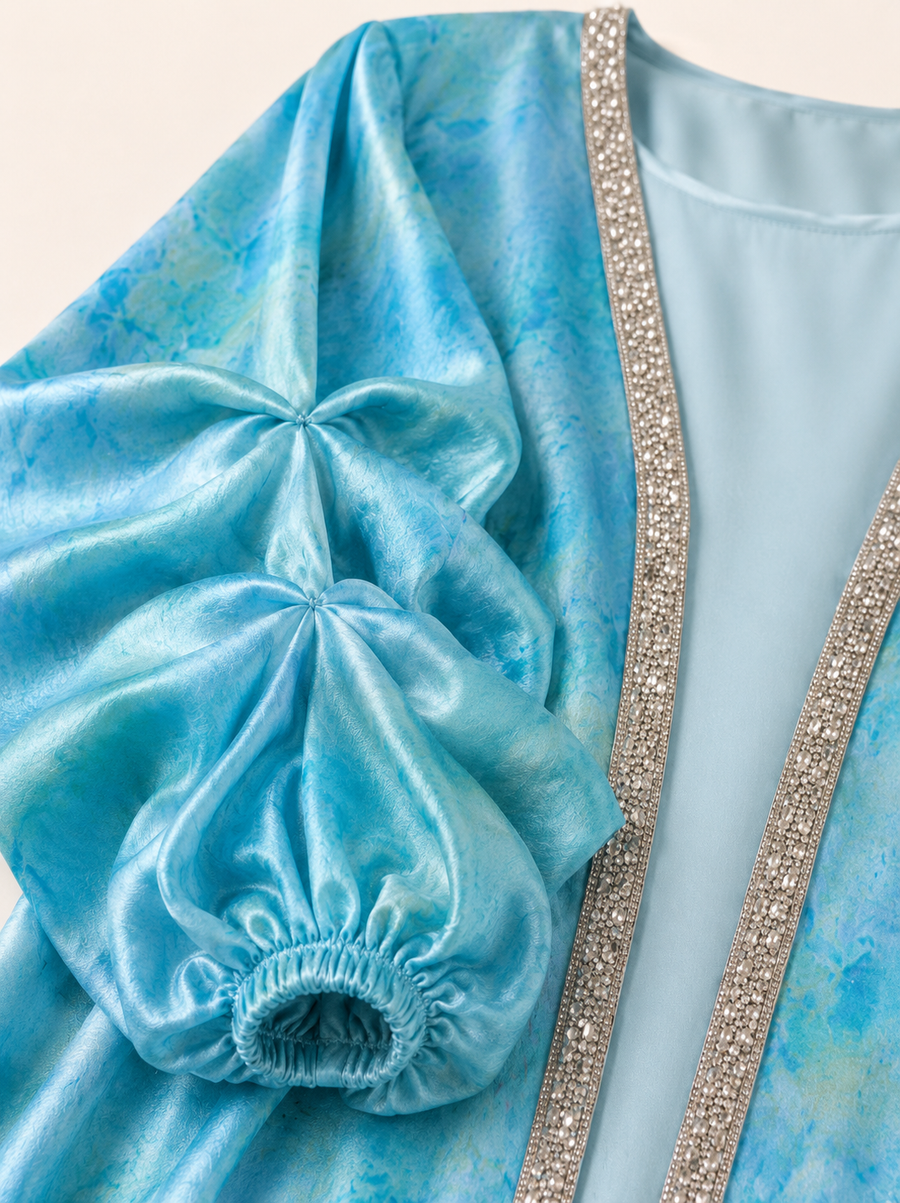 Turquoise Paddle Pop Kaftan — tie-dye fabric and trim detail