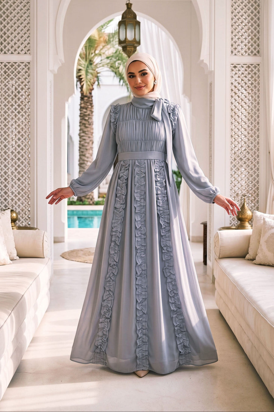 Lifestyle image of the Dove grey Ethereal Edit dress in motion, showing the graceful drape and flowing hemline of the chiffon.