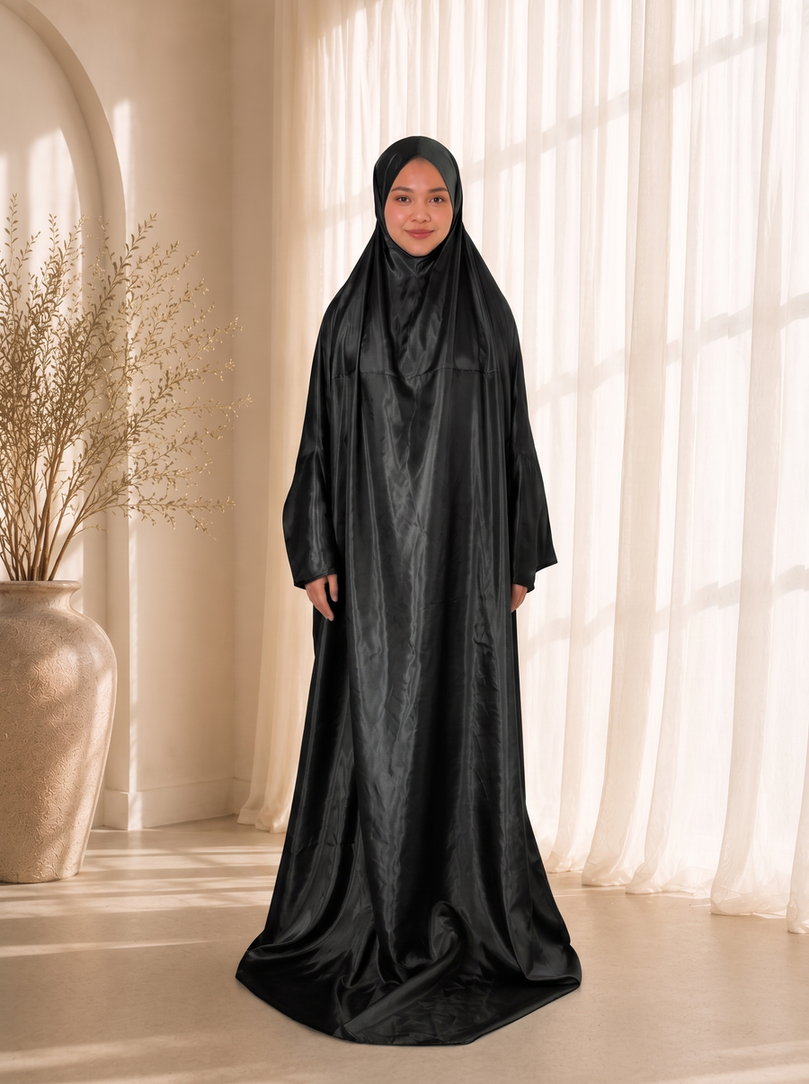 Lightweight Travel Prayer Dress in Black satin, worn by model. Lifestyle visualisation — digitally created
