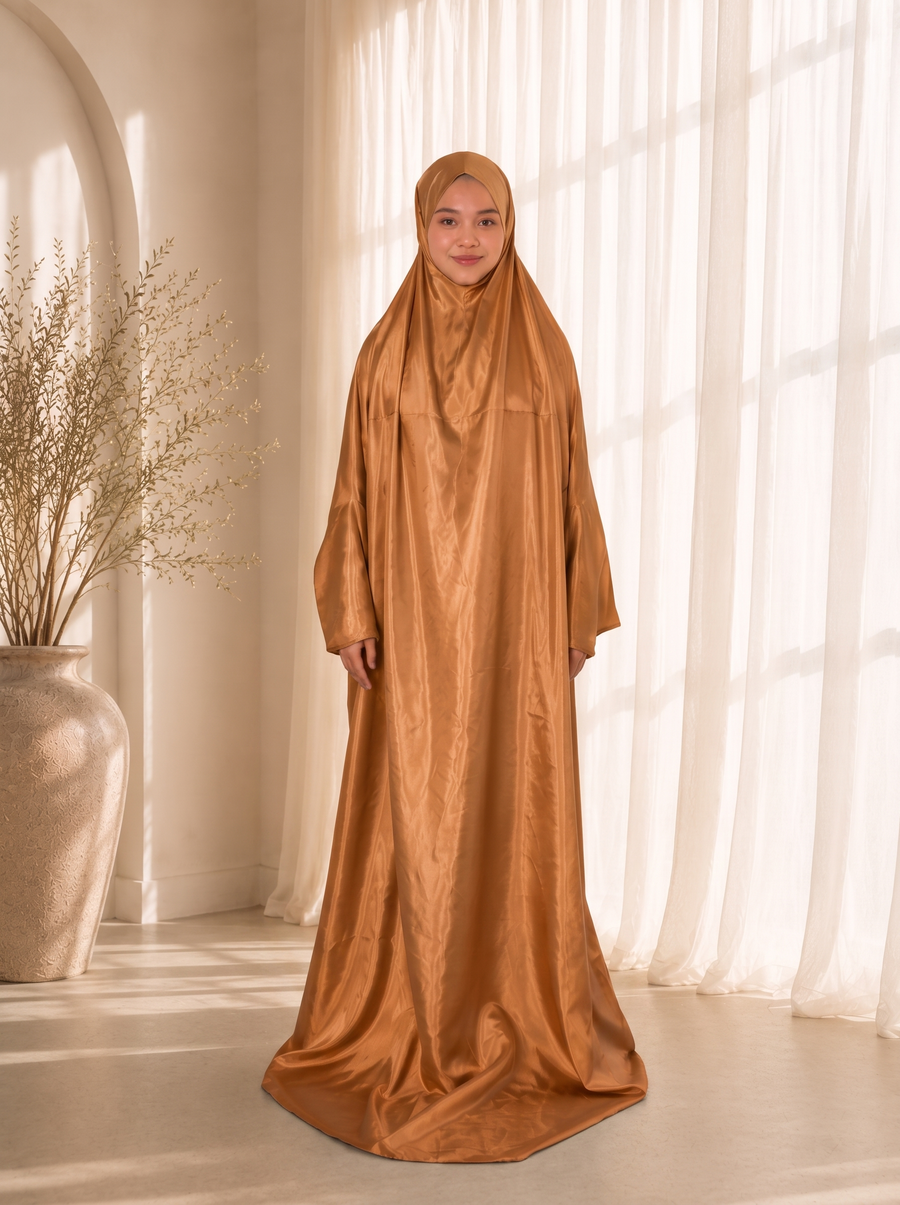 Sakina Gift Set prayer dress in Savannah caramel satin, worn by model. Lifestyle visualisation — digitally created