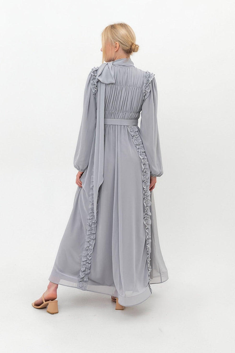 Back view of the Dove grey Ethereal Edit chiffon dress, showing the modest full-length cut and elegant flow of the hemline.