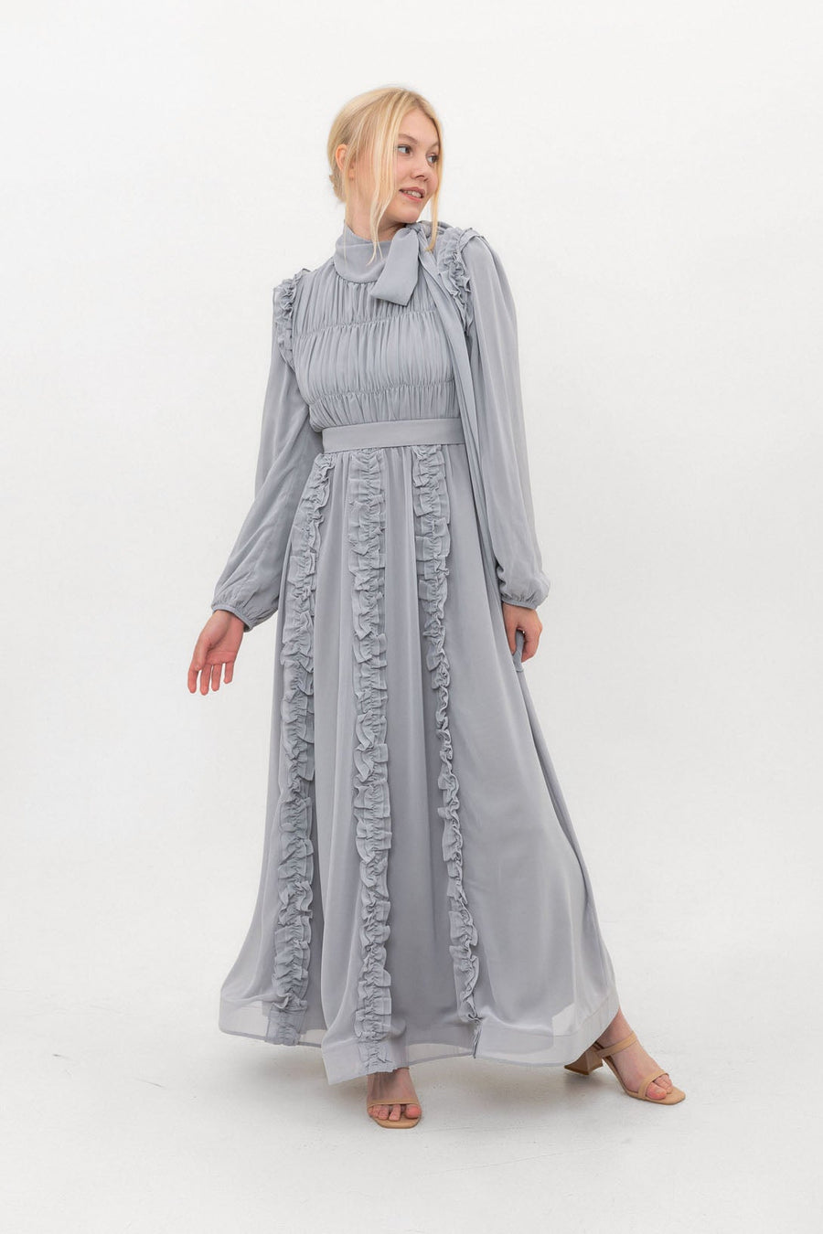Model wearing the Ethereal Edit chiffon modest dress in Dove grey, full-length front view showing the modest silhouette and full sleeve coverage.