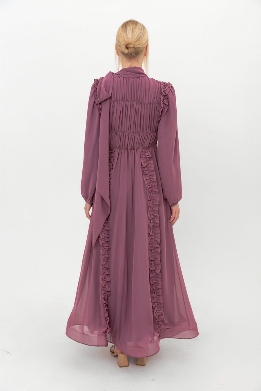 Back view of the Plum Ethereal Edit chiffon dress, showing the full-length modest silhouette and rich jewel tone.