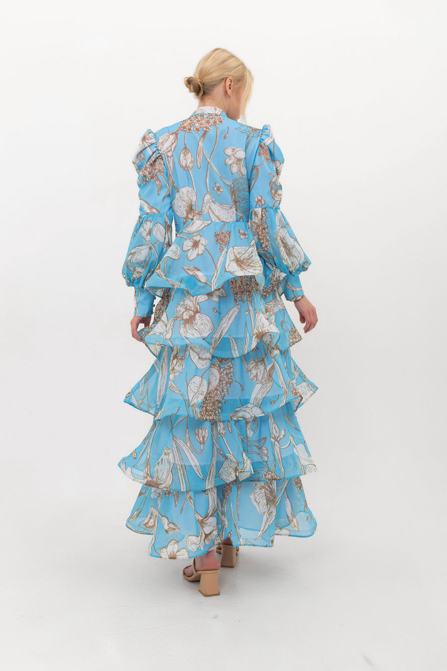 The Bloom Edit tiered chiffon dress in Blue, back view.