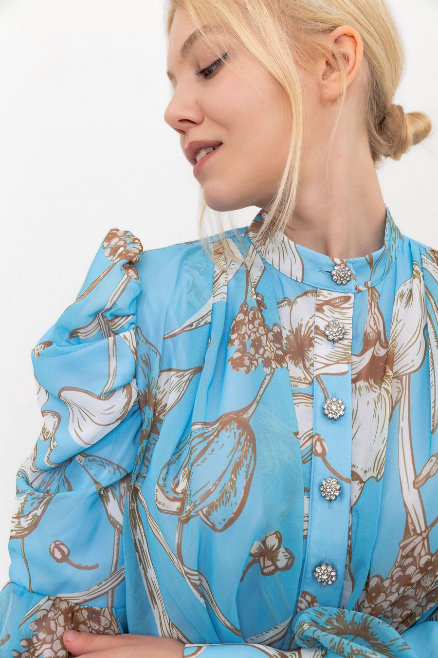 Close-up of the buttons and hand-drawn floral print on The Bloom Edit dress in Blue.
