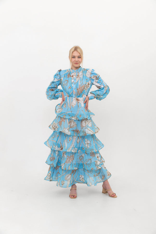 The Bloom Edit tiered chiffon dress in Blue, front view.