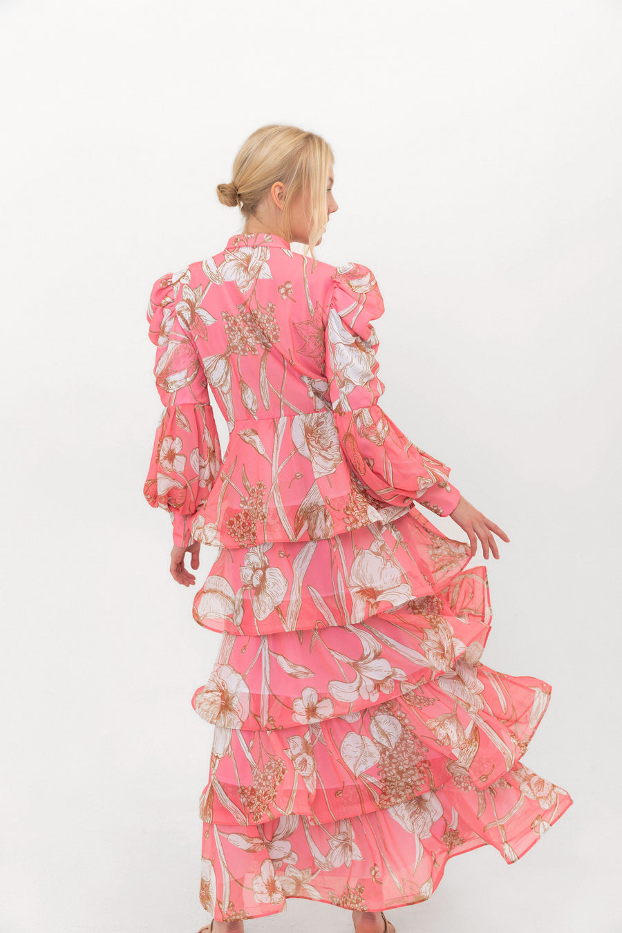 The Bloom Edit tiered chiffon dress in Coral Pink, back view.
